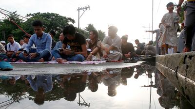 Prayers in Manila. AP Photo