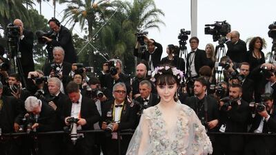 Fan Bingbing looked delightful in this delicate, flowered Marchesa gown, with headdress, at Cannes in 2015. EPA
