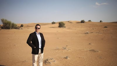 Adam McEwan, the managing director of Platinum Heritage Tours, on the grounds of his company's conservation plot. The grounds make up the largest animal conservation area in the UAE according to the company. The company also has the largest fleet of vintage Land Rovers in the area. Lee Hoagland / The National