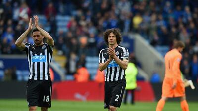 Fabricio Coloccini and Jonas Gutierrez applaud supporters after their Premier League loss to Leicester City on Saturday. Michael Regan / Getty Images / May 2, 2015