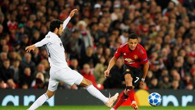 Manchester United's Alexis Sanchez in action with Valencia's Dani Parejo. Reuters