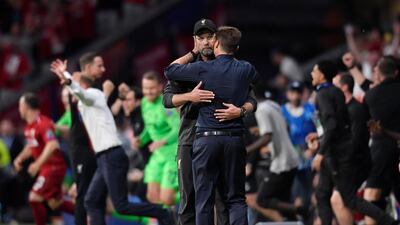 Klopp and Tottenham manager Mauricio Pochettino embrace after the match. Reuters