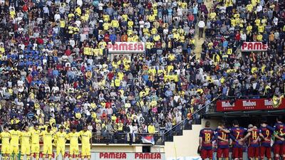 Villarreal CF (L) and FC Barcelona’s (R) players observe a minute of silence in tribute to the victims of a bus crash that has left at least 14 erasmus students dead in Tarragona, before the start of their Spanish Liga Primera Division football match played at El Madrigal stadium, in Villarreal, eastern Spain, 20 March 2016. EPA/Kai Foersterling