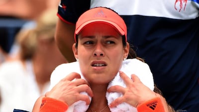 Ana Ivanovic of Serbia uses a cool towel between sets against Dominika Cibulkova of Slovakia during their US Open women's singles match at the USTA Billie Jean King National Tennis Center August 31, 2015 in New York. AFP PHOTO / TIMOTHY A. CLARY