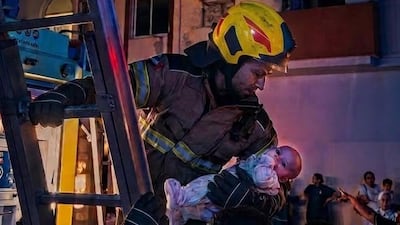Sharjah firefighters rescued a baby girl after a fire broke out at her family's apartment. Photo: Sharjah Civil Defence Authority