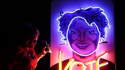 Rachel Lomas, who supports Ms Abrams, stands next to an installation she created on her 'Vote Truck', on November 4, in Midway, Georgia. Getty / AFP