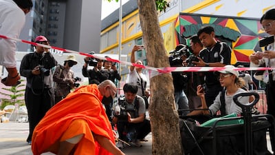 A Buddhist monk prays at the scene. Heavy smoke forced many to flee the venue near the bathrooms at the back, as there were no fire escapes. Reuters