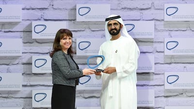 Sheikh Mohammed bin Rashid presents an award to a winner of the Arab Social Media Influencers Awards. Wam