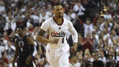 Damian Lillard of the Portland Trail Blazers celebrates after scoring in his team's Game 6 win over the Los Angeles Clippers in the NBA play-offs on Friday night. Steve Dykes / Getty Images / AFP / April 29, 2016