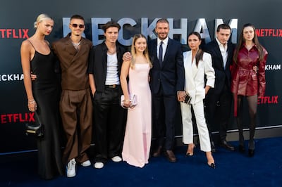 Mia Regan, left, and Nicola Peltz, right, with the Beckham family, Romeo, Cruz, Harper, David, Victoria and Brooklyn at the UK premiere of the footballer's 2023 Netflix documentary. WireImage