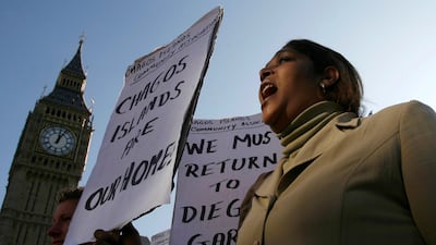 A demonstrator demands her return to the Chagos Islands outside the UK parliament. Reuters