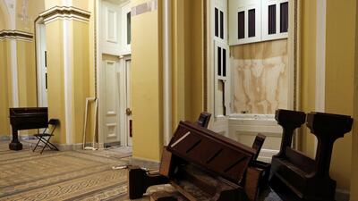 Upended furniture litters a hallway after supporters of US President Donald Trump occupied the Capitol Building after Congress convened to certify the Electoral College votes of the 2020 presidential election. Reuters
