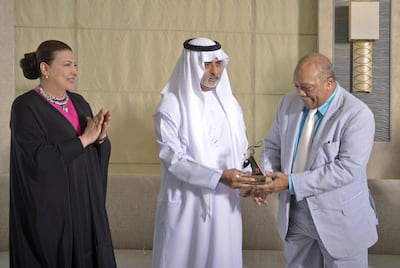 Sheikh Nahyan bin Mubarak, UAE Minister of Culture, Youth and Community Development, presents Quincy Jones with the Abu Dhabi Festival Award as the Admaf founder Hoda Al Khamis-Kanoo looks on. Photo: Abu Dhabi Festival.