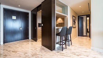 The kitchen is located by the entrance and has a handy breakfast bar.