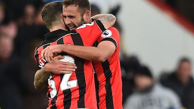 Bournemouth’s Steve Cook and Jack Wilshere celebrate their victory after the match. Glyn Kirk / AFP
