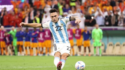 Lautaro Martinez scores the winning penalty for Argentina. Getty