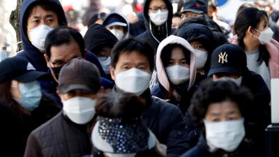 People stand in a long queue to buy face masks at a post office, after a shortage of masks amid the rise in confirmed cases of the novel coronavirus in Daegu, South Korea. Reuters