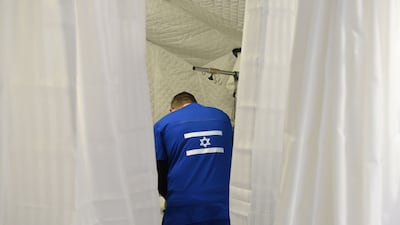 An Israeli medic treats a Ukrainian patient at an Israeli-funded field hospital in Lviv, western Ukraine, on March 23, 2022. AFP