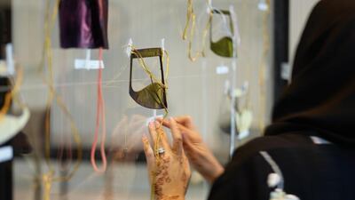 Noura Al Mansouri’s installation Burqa Portrait of 50 Ladies looks at women’s adornment across the generations. Courtesy Lest We Forget