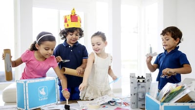 Lina Hamani, 5, Youssef Ben Mlouka, 5, Lillie Vouilloux, 5, and Taha Lahsini, 4, with the latest KenziBox, Medieval Tales, which inspires children’s imagination through arts and crafts. Sarah Dea / The National
