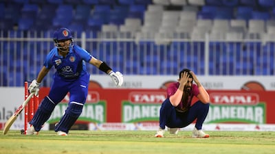 Haider Ali of the UAE looks dejected as Afghanistan pile on the runs in Sharjah.