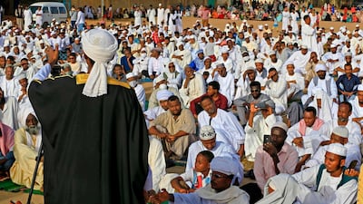 An Imam preaches a sermon to worshippers during Eid Al Fitr prayers in the district of Jureif Gharb of Sudan's capital Khartoum AFP