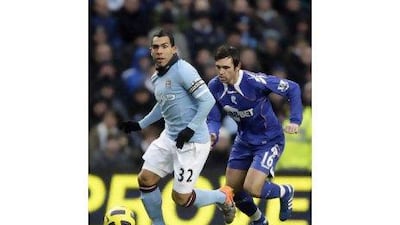 A fourth-minute goal from Carlos Tevez, left, the Argentine striker, was enough to earn Manchester City all three points at home to Bolton Wanderers yesterday. Jon Super / AP Photo