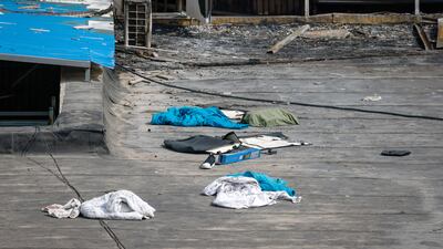 Clothes and belongings left on the back of a building following the fire. EPA