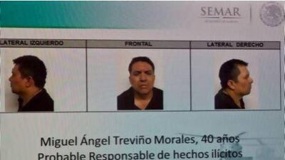 Mug shots of the Zetas drug cartel leader Miguel Angel Trevino Morales are shown on a TV screen during a news conference by the Mexican government.