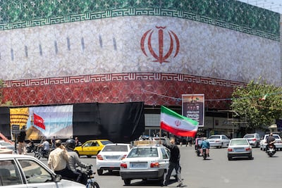 A billboard displaying the Iranian flag in Tehran, Iran. Getty