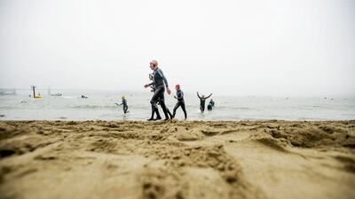 Swimmers emerge from the San Francisco Bay during the 34th annual Escape from Alcatraz Triathlon in San Francisco on Sunday. Noah Berger / Reuters / June 1, 2014