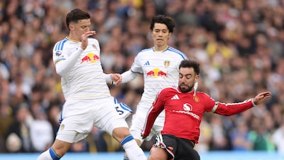 Man United's Bruno Fernandes was booked for this challenge on Tarik Muharemovic of Leeds. Getty Images