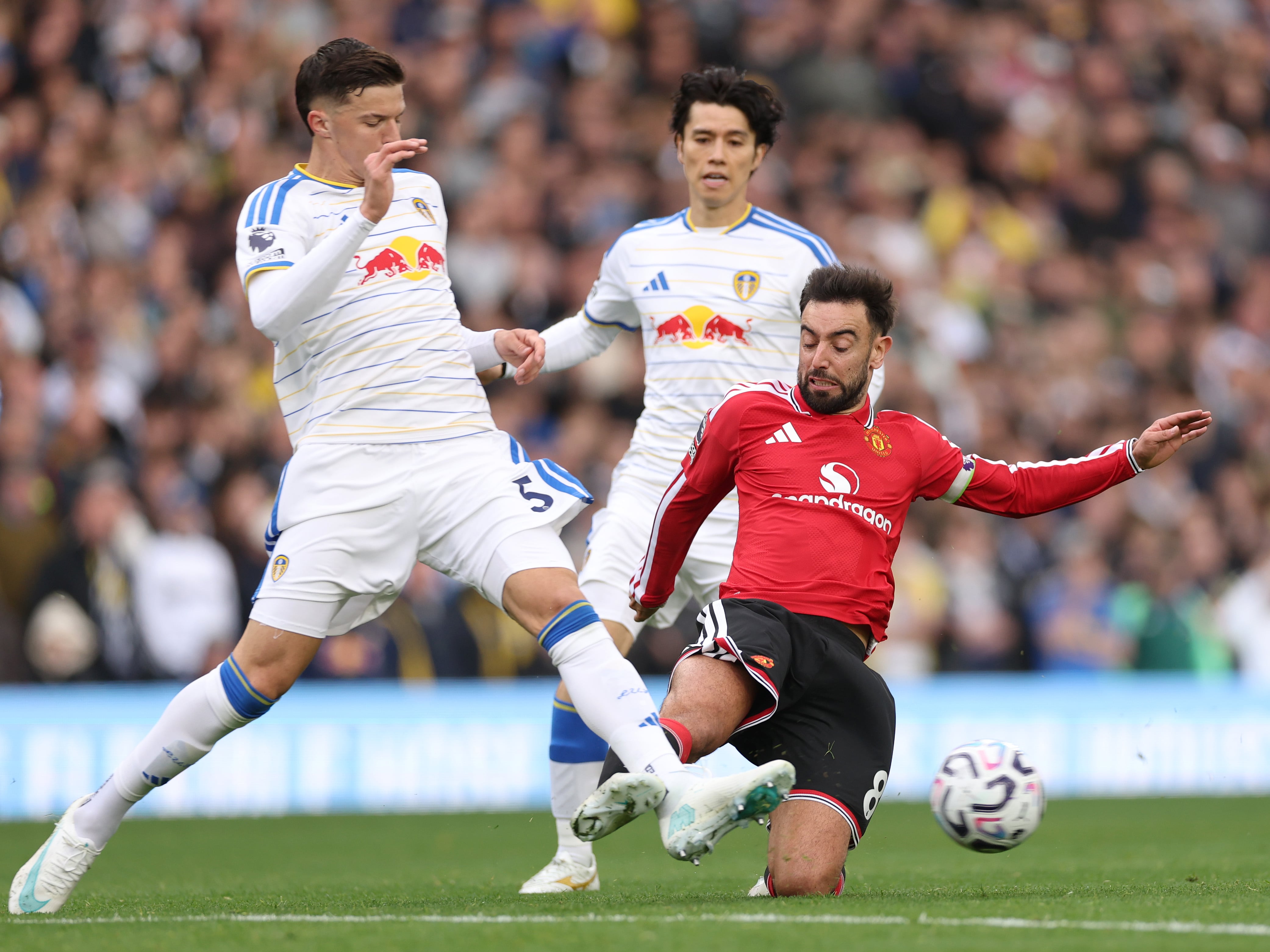 Man United's Bruno Fernandes was booked for this challenge on Tarik Muharemovic of Leeds. Getty Images