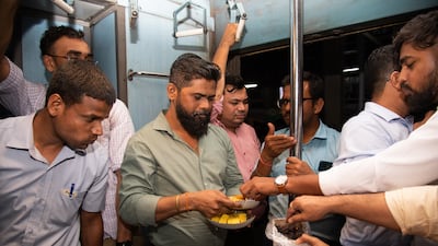 Mr Najeeb is part of a group of Hindu and Muslim friends who share iftar aboard the train as they commute back to Palghar from Mumbai