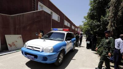 Yemeni police inspect the site of a bomb attack at a university in Sanaa on Monday. Yahya Arhab/EPA