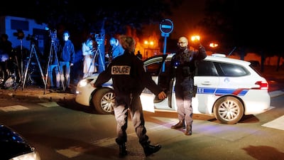 Police officers secure the scene of a stabbing attack in the Paris suburb of Conflans St Honorine. Reuters