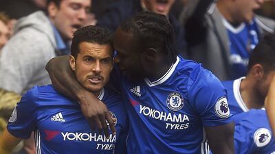 Chelsea’s Pedro is congratulated by teammate Victor Moses. Will Oliver / EPA