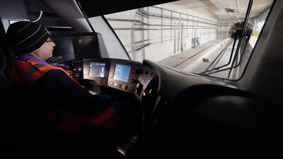An Elizabeth line train is driven from Paddington to Canary Wharf Station. PA