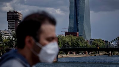 A man walks in front of the European Central Bank in Frankfurt, Germany. The jobless rate in the country has spiked to 5.8%, the highest level in three years. AP Photo