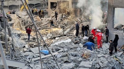 Rescuers search for survivors and victims' bodies. AP