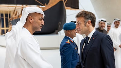 Mr Macron is greeted by Staff Maj Gen Musallam Al Rashidi, Director of the Office of the Supreme Commander of the Armed Forces
