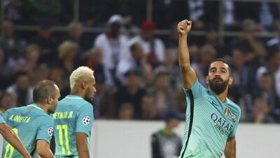 Barcelona’s Arda Turan reacts after scoring the team’s opening goal against Borussia Monchengladbach. Kai Pfaffenbach / Reuters