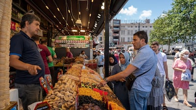 Shoppers at a spice market in Istanbul. Turkey's economy has been battered by high inflation and pressure on the lira. Bloomberg
