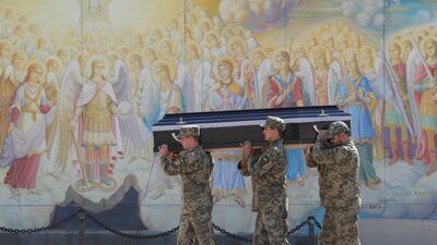 Ukrainian soldiers carry a comrade's coffin at St Mikhailovsky Cathedral during a funeral ceremony in Kyiv, Ukraine. EPA