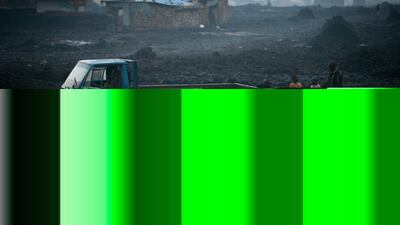 Men load a truck in Goma, Democratic Repblic of Congo. Mining companies operate under difficult conditions in the volatile country. Ryan Carter / The National