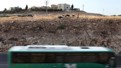 An Israeli bus passes through the occupied West Bank. Jim Hollander / EPA