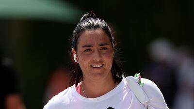 Ons Jabeur of Tunisia makes her way to a practice session at All England Lawn Tennis and Croquet Club. Getty Images