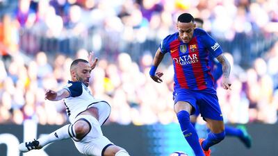 Neymar of Barcelona competes for the ball with Guilherme dos Santos of Deportivo La Coruna. David Ramos / Getty Images