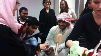 Contestants in the short film competition take part in the makeup element of the three-month programme.