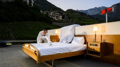 A butler irons the bed of the 'anti-idyllic' suite.